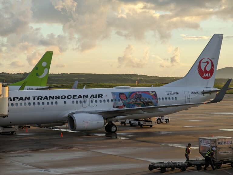 Japan Transocean Air and Spring Japan aircraft parked at New Ishigaki Airport in Okinawa, Japan, at dusk